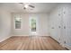Bedroom featuring hard wood floors, neutral walls, and access to a private outdoor seating area at 53 Forest Oaks Dr, Durham, NC 27705