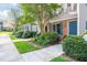 Attractive townhome exterior with manicured landscaping, blue shutters, and a sidewalk at 53 Forest Oaks Dr, Durham, NC 27705