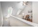 Hallway with desk and chair featuring vaulted ceilings and natural light at 53 Forest Oaks Dr, Durham, NC 27705