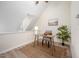 Office nook with a desk, chair, hardwood floors, a painting, and natural lighting at 53 Forest Oaks Dr, Durham, NC 27705
