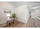 Office nook with hardwood floors, large painting, and views to the bedroom at 53 Forest Oaks Dr, Durham, NC 27705