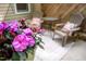 Close up of the colorful flowers and seating on the private outdoor patio at 53 Forest Oaks Dr, Durham, NC 27705