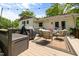 Back deck featuring outdoor seating, string lights, a grill and a lush green yard at 5505 Knollwood Rd, Raleigh, NC 27609