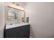 Stylish bathroom featuring modern fixtures, a vanity, a mirror, and a sink at 5505 Knollwood Rd, Raleigh, NC 27609