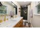 Updated bathroom featuring a double sink vanity, a stylish shower and modern fixtures at 5505 Knollwood Rd, Raleigh, NC 27609