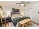 Well-lit bedroom features a cozy bed, ceiling fan, and ample closet space providing a restful retreat at 5505 Knollwood Rd, Raleigh, NC 27609