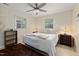 Bright bedroom with a ceiling fan, neutral decor, and ample natural light creating a serene and restful retreat at 5505 Knollwood Rd, Raleigh, NC 27609