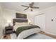 This bedroom boasts a ceiling fan, closet, and is complemented by natural light from the windows at 5505 Knollwood Rd, Raleigh, NC 27609