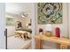 View into a well-lit bedroom featuring neutral tones, a ceiling fan, and stylish accents creating an inviting space at 5505 Knollwood Rd, Raleigh, NC 27609