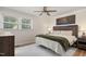 The bedroom features a ceiling fan and neutral walls, creating a serene and inviting space at 5505 Knollwood Rd, Raleigh, NC 27609