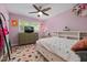 bedroom featuring colorful decor, carpet, ample natural light and a ceiling fan at 5505 Knollwood Rd, Raleigh, NC 27609