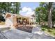 Charming home with a welcoming front porch adorned with plants and ample seating at 5505 Knollwood Rd, Raleigh, NC 27609