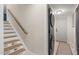 This laundry room features a stacked washer and dryer, conveniently located near the staircase at 5505 Knollwood Rd, Raleigh, NC 27609