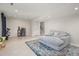 A basement living room is accentuated by warm tile flooring, lots of light and ample seating at 5505 Knollwood Rd, Raleigh, NC 27609