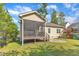 View of screened porch and backyard with play set at 615 Prides Crsg Xing, Rolesville, NC 27571