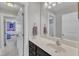 Bathroom featuring a vanity with marble countertops, an adjoining room, and neutral walls at 615 Prides Crsg Xing, Rolesville, NC 27571
