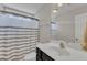 Bathroom featuring a vanity with marble countertops, a toilet and a shower-tub combo at 615 Prides Crsg Xing, Rolesville, NC 27571