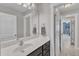 Bathroom featuring a vanity with marble countertops, an adjoining room, and neutral walls at 615 Prides Crsg Xing, Rolesville, NC 27571