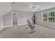 Spacious bonus room with neutral walls, carpet, and plenty of natural light, perfect for a home gym at 615 Prides Crsg Xing, Rolesville, NC 27571