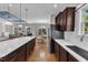 Open-concept kitchen flows into the dining and living areas, with stainless appliances and a large island at 615 Prides Crsg Xing, Rolesville, NC 27571