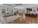 Bright living room with open layout to kitchen, featuring hardwood floors and neutral decor at 615 Prides Crsg Xing, Rolesville, NC 27571