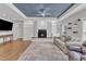 Spacious living room features a fireplace, hardwood floors, and a tray ceiling at 615 Prides Crsg Xing, Rolesville, NC 27571