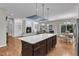 Spacious living area with a fireplace, built-in shelving, and large windows for natural light at 615 Prides Crsg Xing, Rolesville, NC 27571