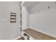 Bright mudroom features a built-in bench with storage, shelving, and hooks for organization and convenience at 615 Prides Crsg Xing, Rolesville, NC 27571