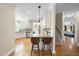 Well-lit kitchen featuring a breakfast bar, granite countertops, and stainless steel appliances at 629 Houndsditch Cir, Wake Forest, NC 27587