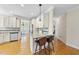 Bright kitchen with granite countertops, stainless appliances and a breakfast bar with seating at 629 Houndsditch Cir, Wake Forest, NC 27587