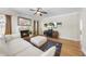 Bright living room features a fireplace, hardwood floors and a comfortable seating area at 629 Houndsditch Cir, Wake Forest, NC 27587