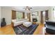 Cozy living room with fireplace, natural light, hardwood floors, and stylish furnishings at 629 Houndsditch Cir, Wake Forest, NC 27587