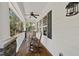 Inviting covered porch with wood flooring and rocking chairs, perfect for relaxing outdoors at 629 Houndsditch Cir, Wake Forest, NC 27587