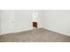 Bedroom features neutral carpet, white walls, a closet, and an ensuite bathroom for added convenience at 6539 Clarksdale Ln, Durham, NC 27713