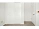 Bedroom featuring neutral carpet and a white closet with sliding doors at 6539 Clarksdale Ln, Durham, NC 27713
