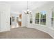 Dining area filled with natural light, featuring a chandelier at 6539 Clarksdale Ln, Durham, NC 27713