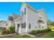 Charming two-story home with light gray siding, black shutters, and a well-manicured lawn at 6539 Clarksdale Ln, Durham, NC 27713
