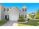 Charming townhouse featuring a one-car garage and well-maintained landscaping at 6539 Clarksdale Ln, Durham, NC 27713