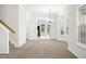 Bright living room features neutral paint, plush carpet and natural light at 6539 Clarksdale Ln, Durham, NC 27713
