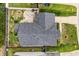 Aerial view of backyard, patio, roof and street at 7028 Pebble Brook Way, Rocky Mount, NC 27804