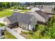 Aerial view showcasing a well-maintained backyard, patio, and proximity to a community playground at 7028 Pebble Brook Way, Rocky Mount, NC 27804