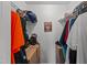 Walk-in closet with shelving and rods for organizing clothes and accessories at 7028 Pebble Brook Way, Rocky Mount, NC 27804