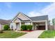 Charming home with covered parking, landscaped yard, and inviting facade at 7028 Pebble Brook Way, Rocky Mount, NC 27804