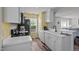 Well-lit kitchen with white cabinets, stainless steel appliances, and stylish countertops at 7028 Pebble Brook Way, Rocky Mount, NC 27804