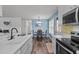 Modern kitchen with stainless steel appliances, eat-in dining area, and updated fixtures at 7028 Pebble Brook Way, Rocky Mount, NC 27804