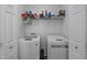 The laundry room features a washing machine and dryer inside of double doors at 7028 Pebble Brook Way, Rocky Mount, NC 27804