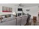 Comfortable living room with a ceiling fan, fireplace, and modern decor at 7028 Pebble Brook Way, Rocky Mount, NC 27804