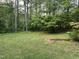 Spacious backyard with mature trees, perfect for outdoor activities and relaxation at 7412 Barberry Ct, Raleigh, NC 27615
