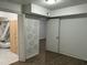 Finished basement area with a decorative honeycomb wall and access to utility space at 7412 Barberry Ct, Raleigh, NC 27615