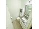 Bathroom with granite countertop, white cabinets, and modern fixtures at 7412 Barberry Ct, Raleigh, NC 27615